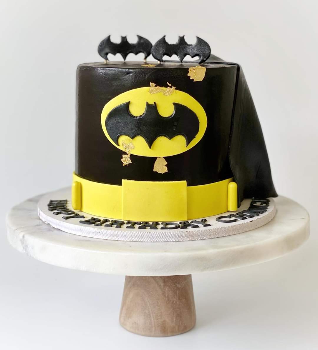 Hugs & Kisses Celebration Cakes - A cake for a young Batman fan. Featuring  Batman's calling sign / logo on top of a night sky with buildings all  around. Bats flying around